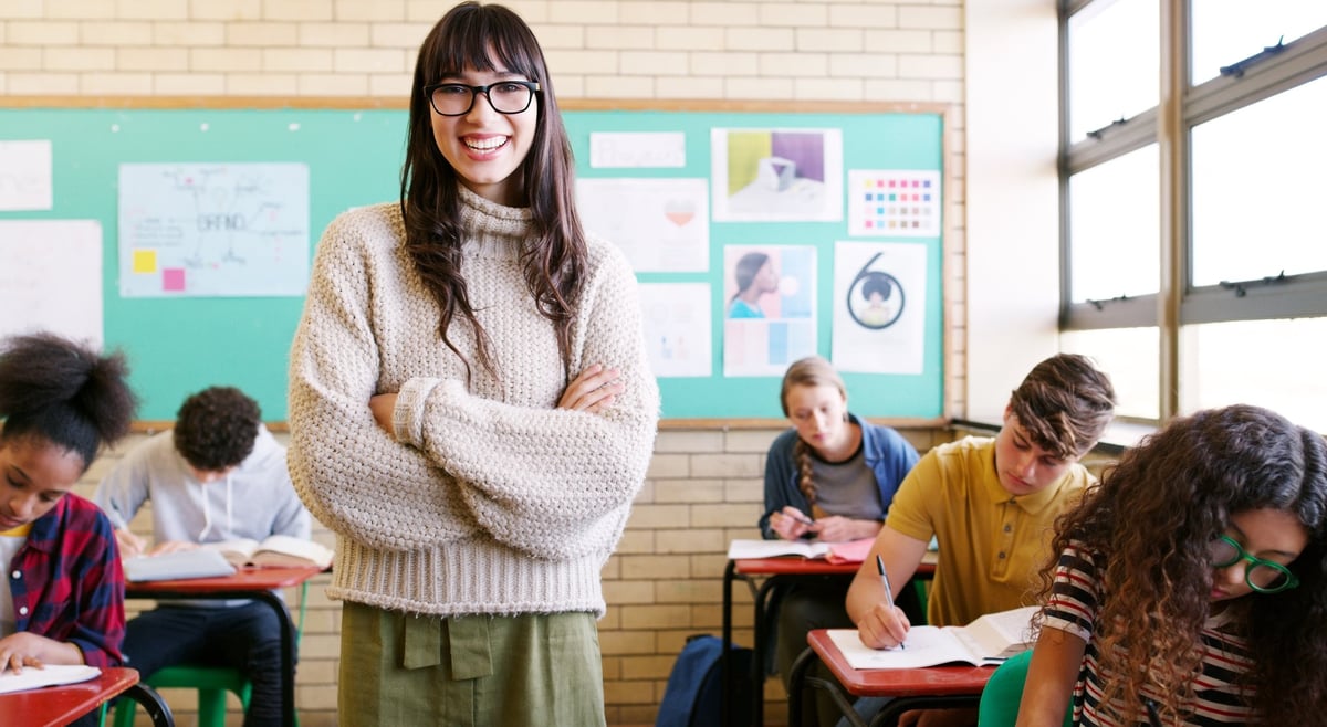 A teacher leading a lesson with a group of engaged students in a classroom